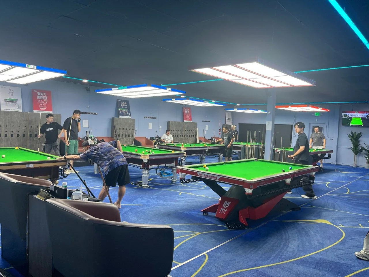 Cue Action Billiard Club main hall with Chinese 8-Ball tables and players