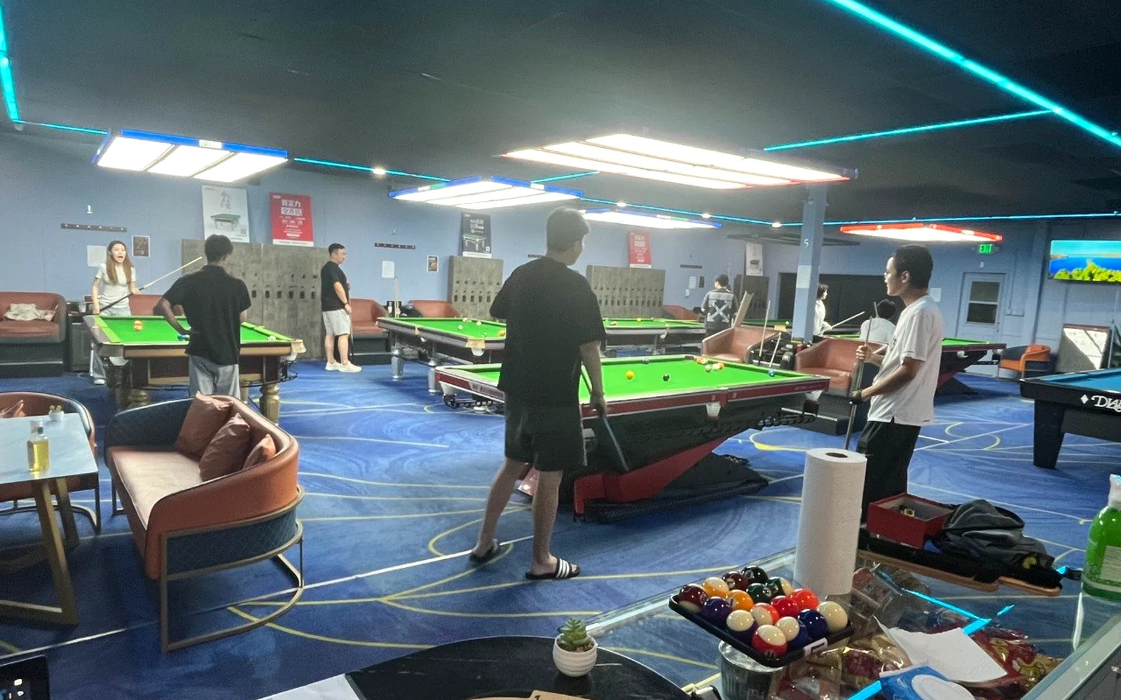 Cue Action Billiard Club active billiards room with players